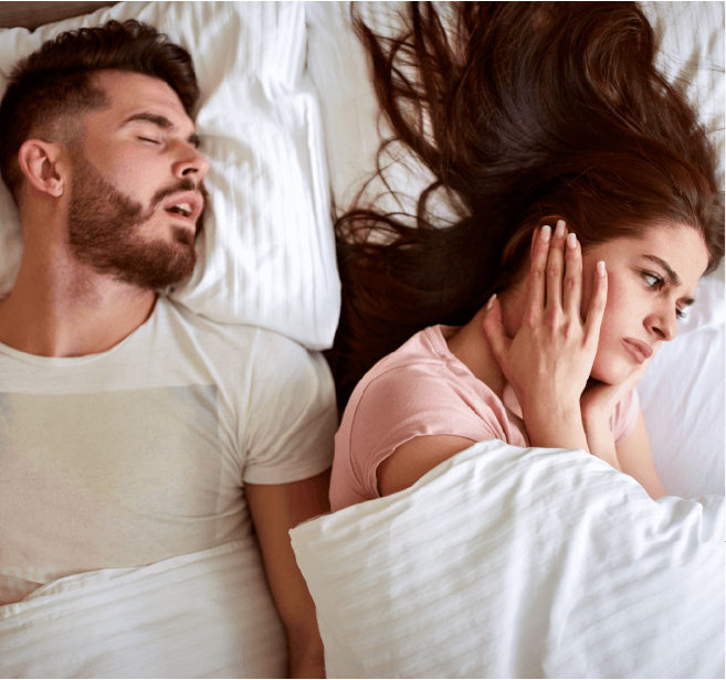 Young couple sleeping - guy snoring, girl can not sleep
