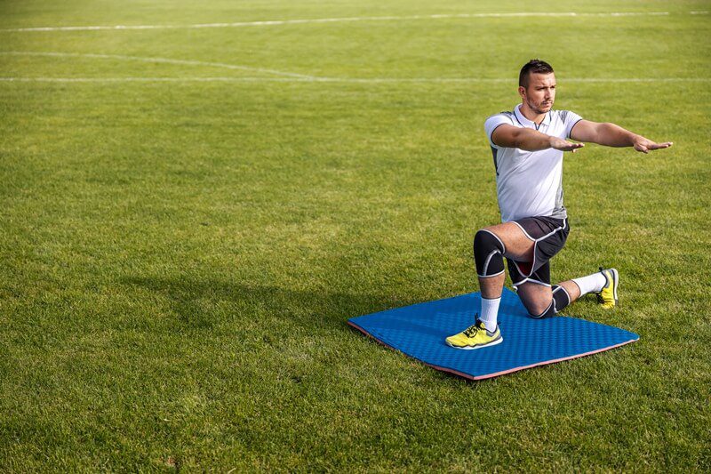 Football player warming up